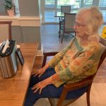 Mount Pleasant Gardens - connecting seniors. A woman connects with her hubby using the FaceTime app.