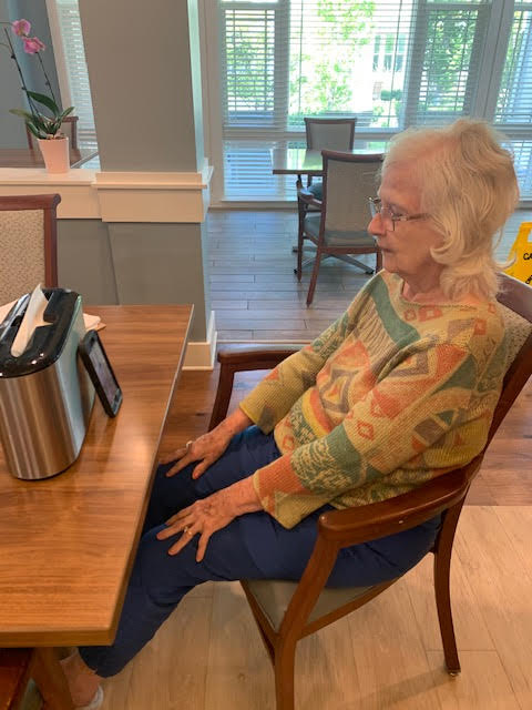 Mount Pleasant Gardens - connecting seniors. A woman connects with her hubby using the FaceTime app.