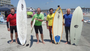 Norman Godley (yellow-lined surfboard) stands with other finalists at the 2015 Eastern Surfing Association Mid Atlantic Finals